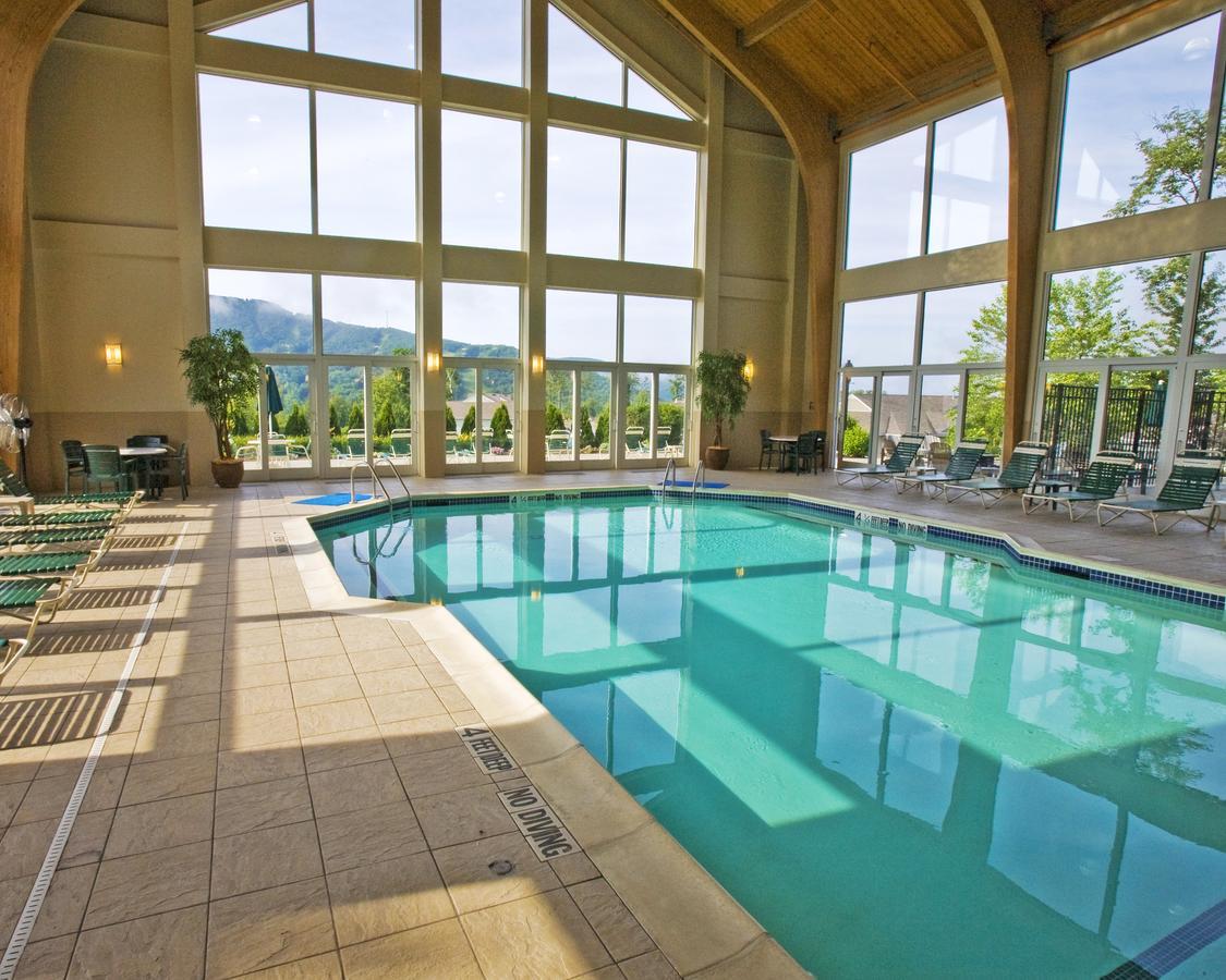 Vacation Village In The Berkshires Hancock Bagian luar foto The indoor pool at the Grand Summit Hotel
